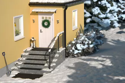 Värmemattan Multimat ligger seriekopplade på trappa och entré för ett hus i vintern